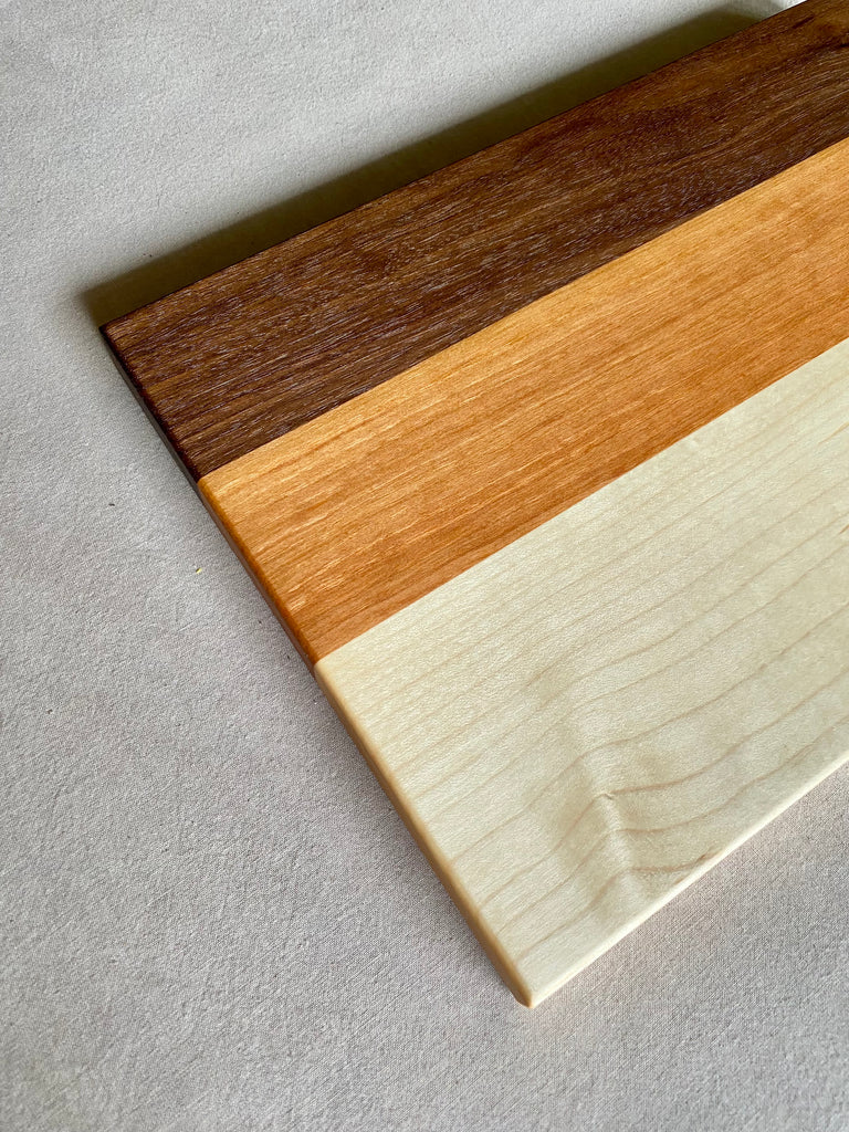 walnut, cherry, and maple hardwood bar board